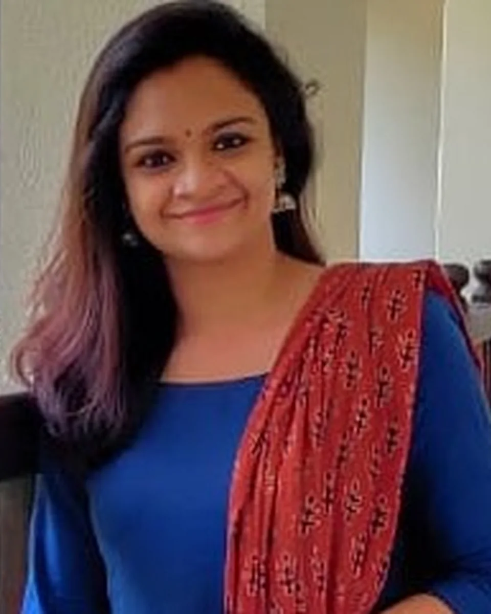 Portrait of Aswathy, speaker at the Q4 Women in Tech Summit